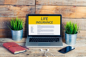 life insurance paperwork on a laptop